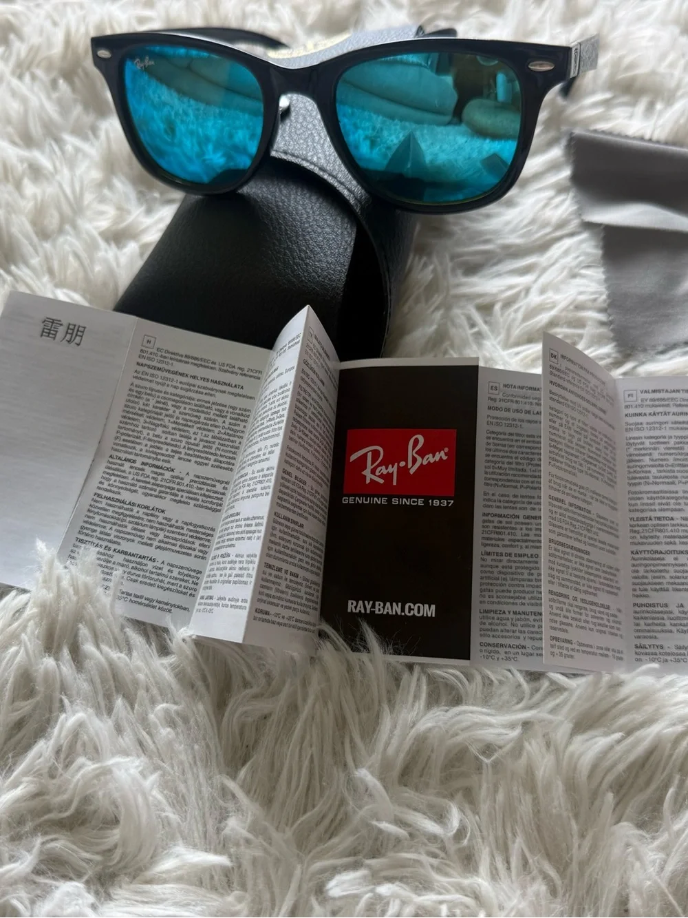 Ray-Ban Black Frame Sunglasses with Blue Mirrored Lenses